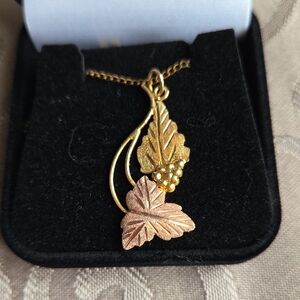 Black Hills Gold Necklace. 2 leaves with a little cluster of Grapes. Marked 12kt